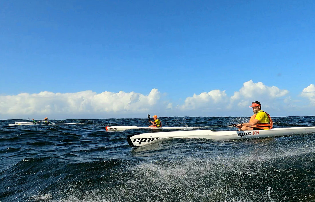 Ocean ski paddlers on the water